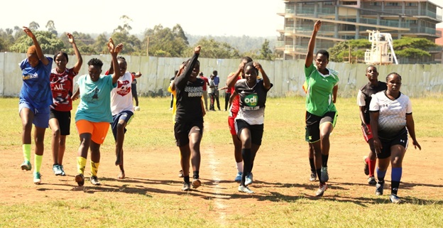 Peter Bukhala instructing an athlete on the pitch22